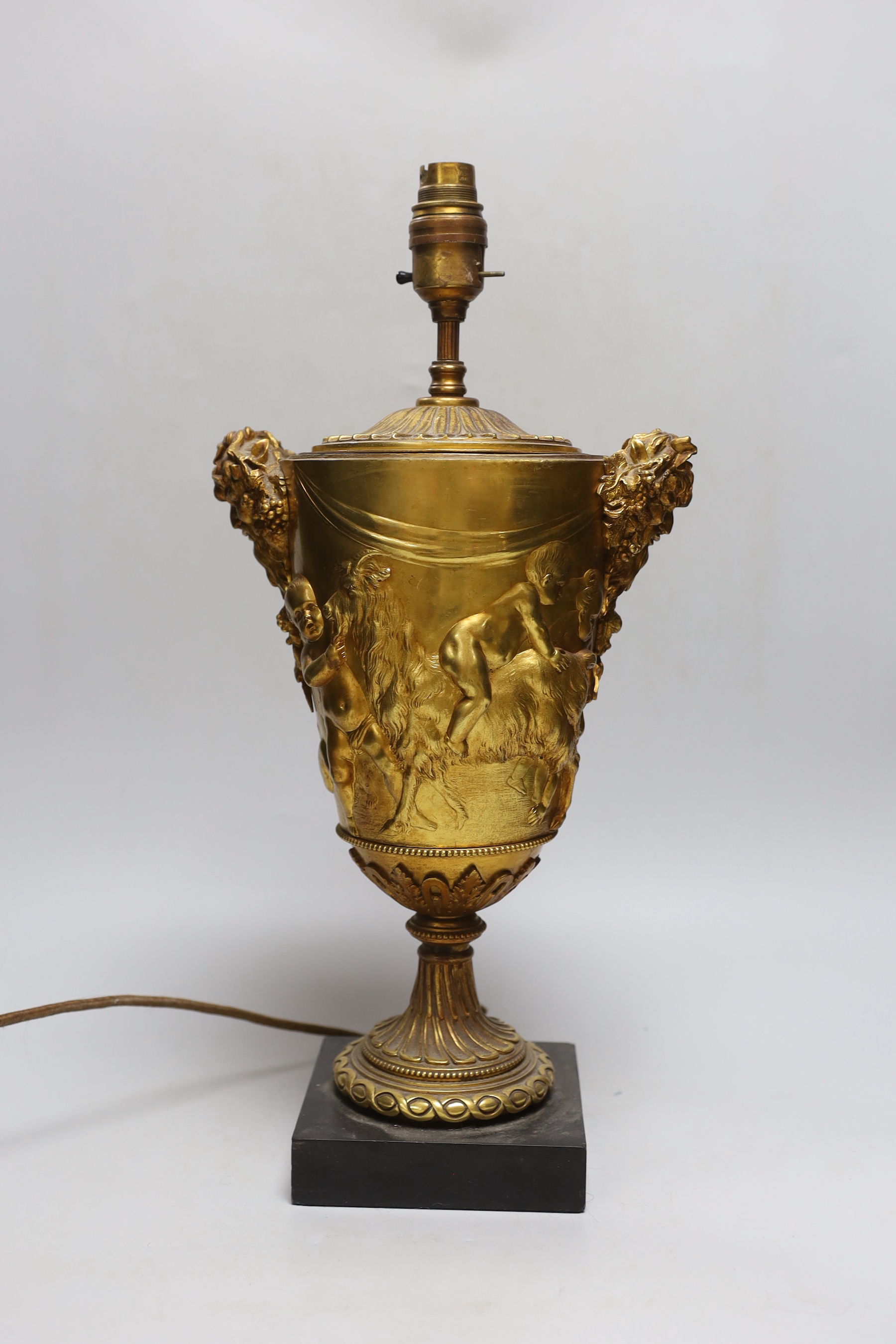 An ormolu urn shaped 'Bacchus' table lamp, 36cm high